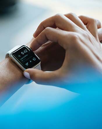 More fitness in less time, clock time, looking at a smart watch